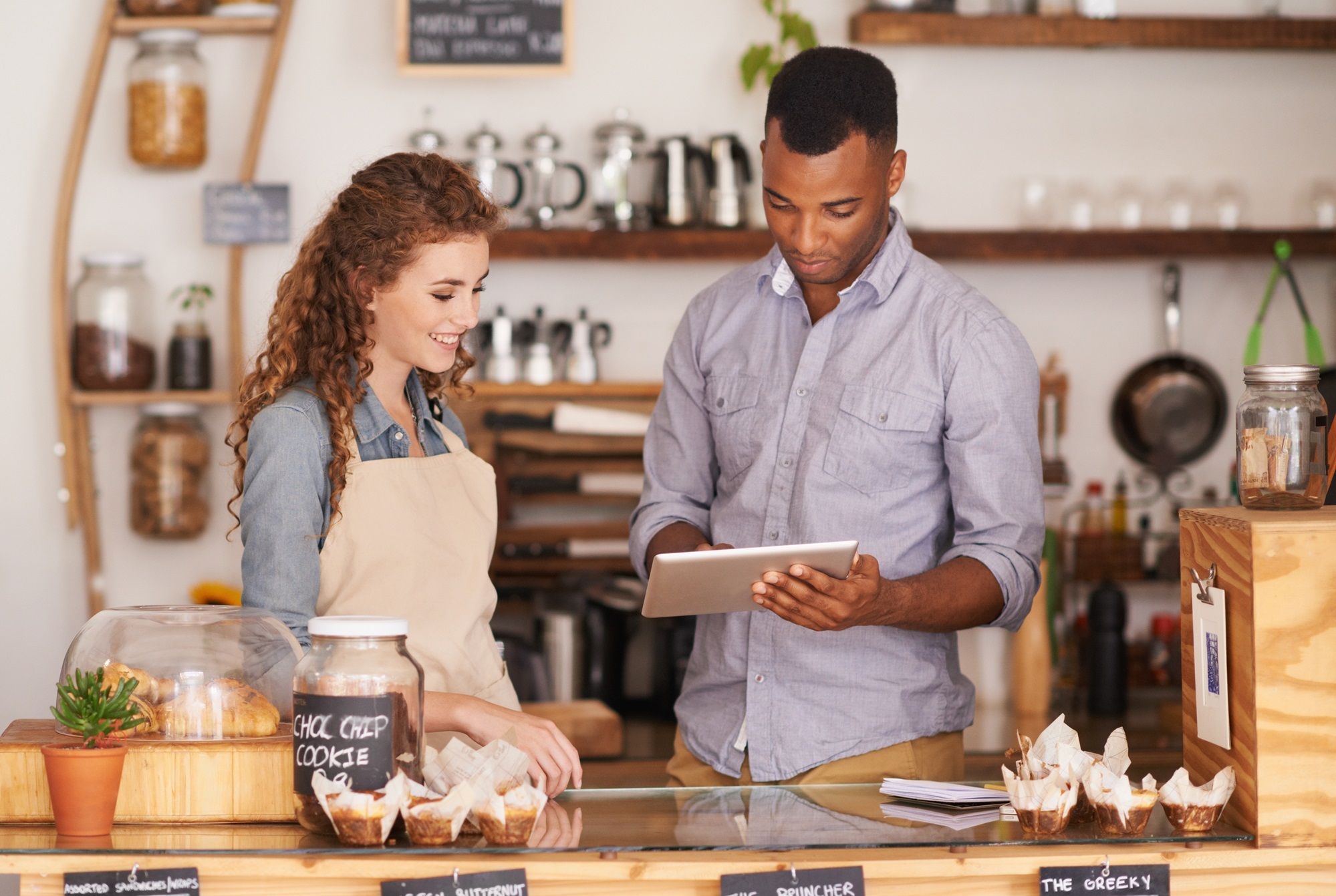 Shot of two people in a cafe